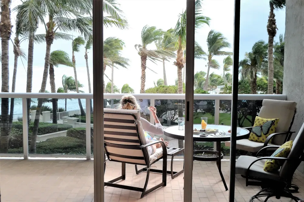 patio overlooking beach at a vacation home.